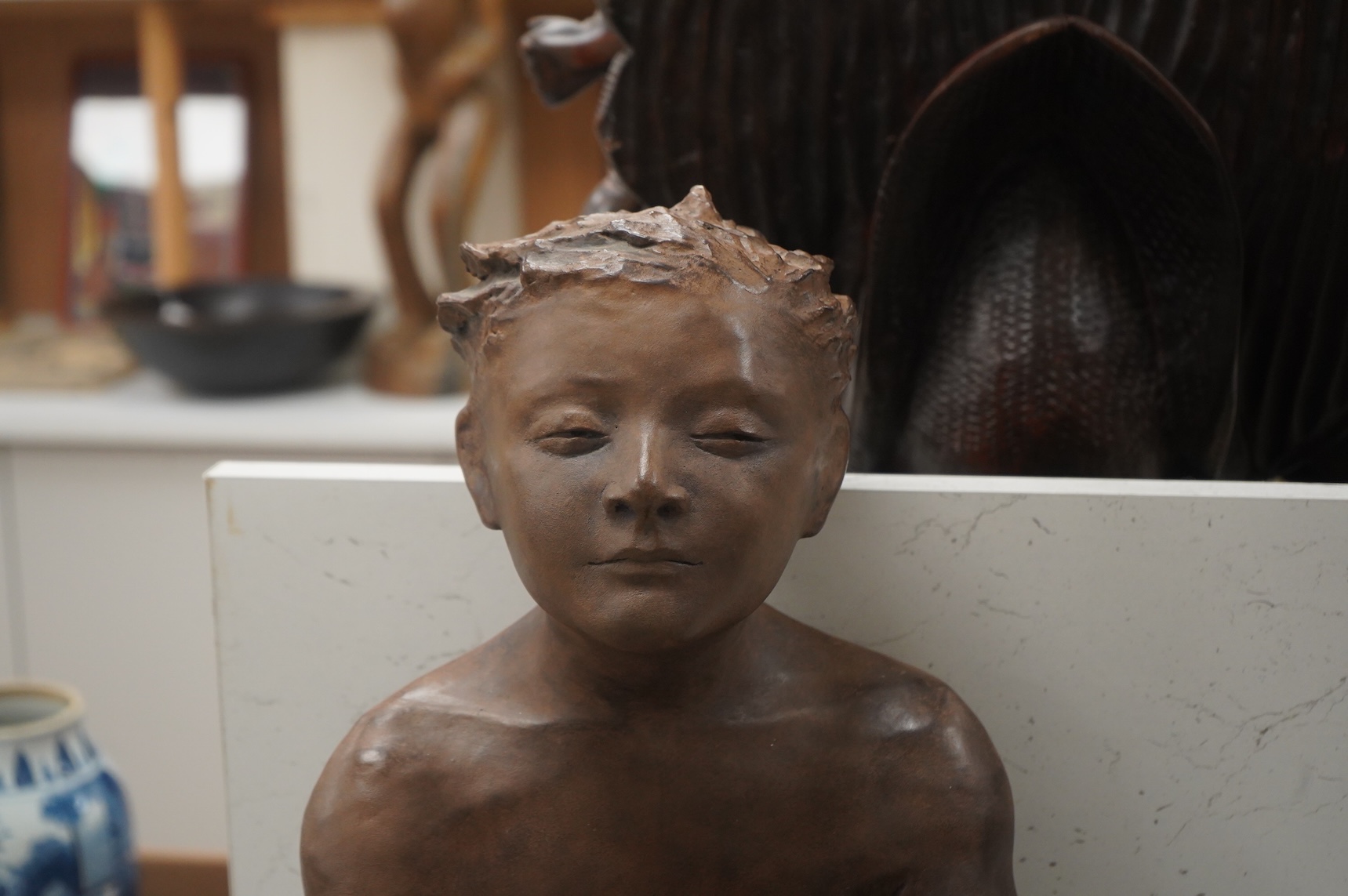A contemporary composition figure of a seated boy and a cat, 46cm